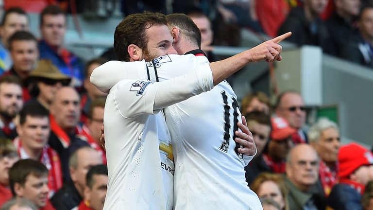 Juan Mata celebrates after scoring his first