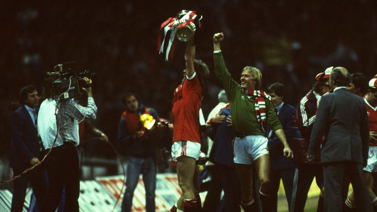 Gordon McQueen and Gary Bailey celebrate winning the FA Cup at Wembley in 1983