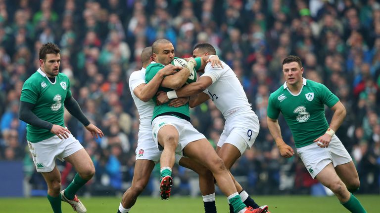 Simon Zebo is tackled by Jonathan Joseph and Anthony Watson