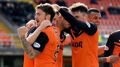Image of Chris Erskine is mobbed by his Dundee United team mates after scoring the winner against Hamilton.