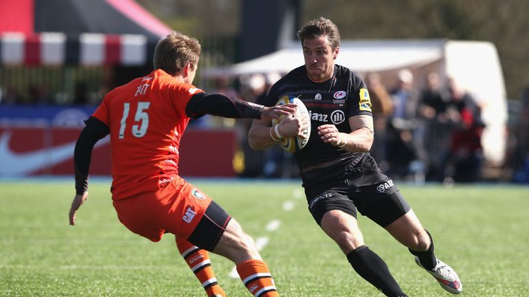 Saracens try-scorer Chris Wyles takes on Mathew Tait