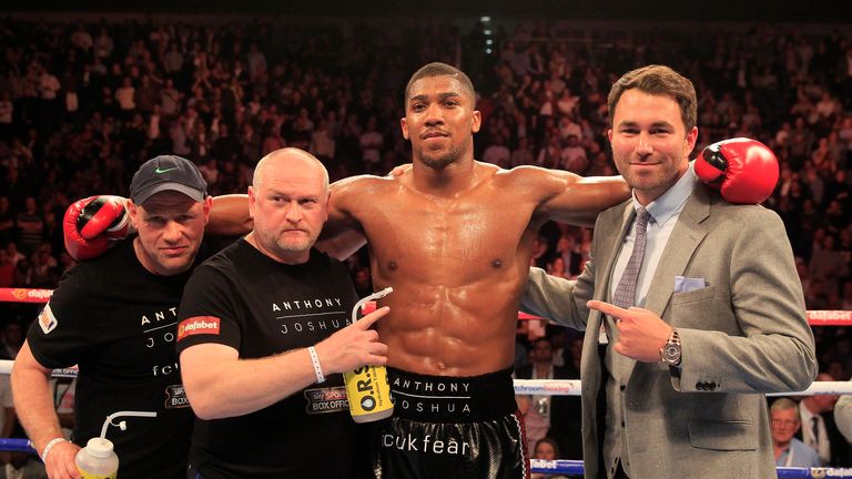 Joshua celebrates with promoter Eddie Hearn (Pic by Lawrence Lustig)
