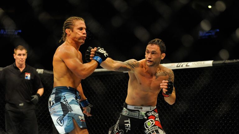 Frankie Edgar (R) hits Urijah Faber