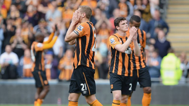 Michael Dawson and the Hull City players show their dejection