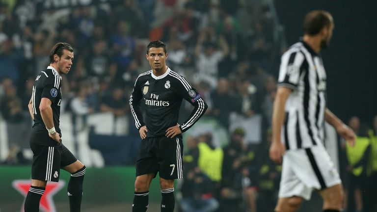 Ronaldo stands with team-mate Gareth Bale during their defeat by Juventus in the Champions League last season