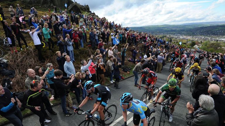 Nordhaug, in the blue jersey, makes his way through the crowds on the Cow and Calf climb