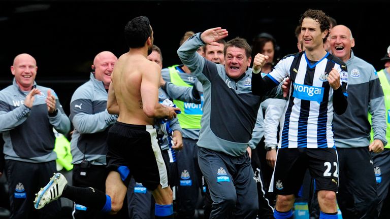John Carver celebrates with Jonas Gutierrez during a 2-0 win over West Ham that ensured Newcastle's survival in 2015