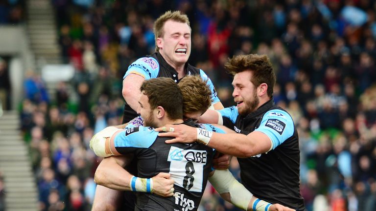 Richie Vernon is mobbed after scoring Glasgow's fourth try against Ulster
