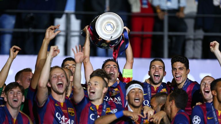 Xavi of Barcelona lifts the trophy