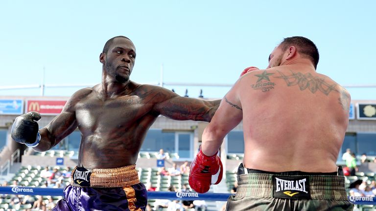 Deontay Wilder (L) is another world champion on Briggs' radar
