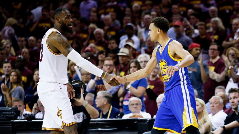 LeBron James (L) shakes hands with Stephen Curry after the Warriors defeated the Cavs to win the 2015 NBA Finals