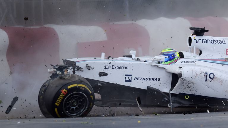 Felipe Massa hits the wall after crashing into Sergio Perez