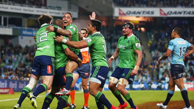 Patrick Osborne is congratulated after scoring the Highlanders' fifth try against the Waratahs