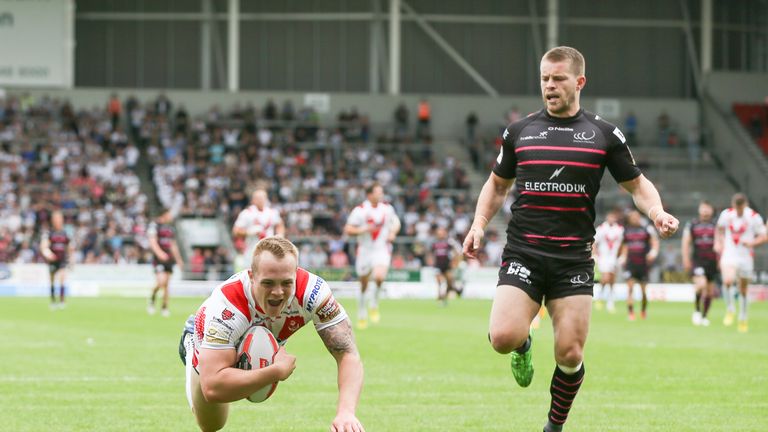 Adam Swift dives over to score St Helens' first try against Widnes