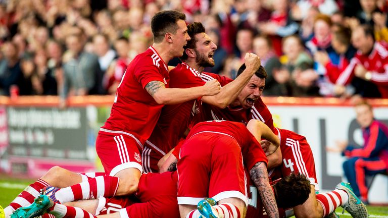 Aberdeen, pictured celebrating Niall McGinn's goal, came back from the brink of an embarrassing collapse