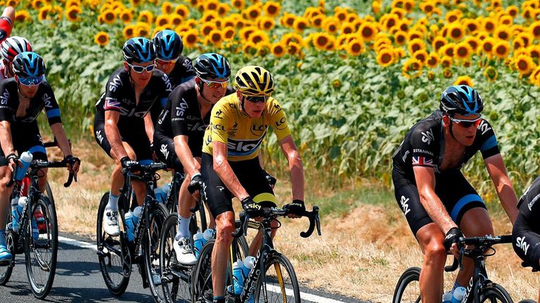Chris Froome survived hot conditions and a frantic finish to retain his overall lead