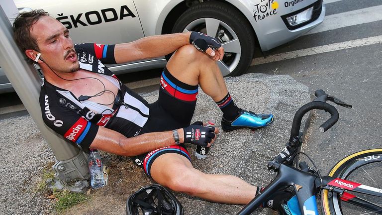 John Degenkolb slumped to the ground in exhaustion after finishing fourth
