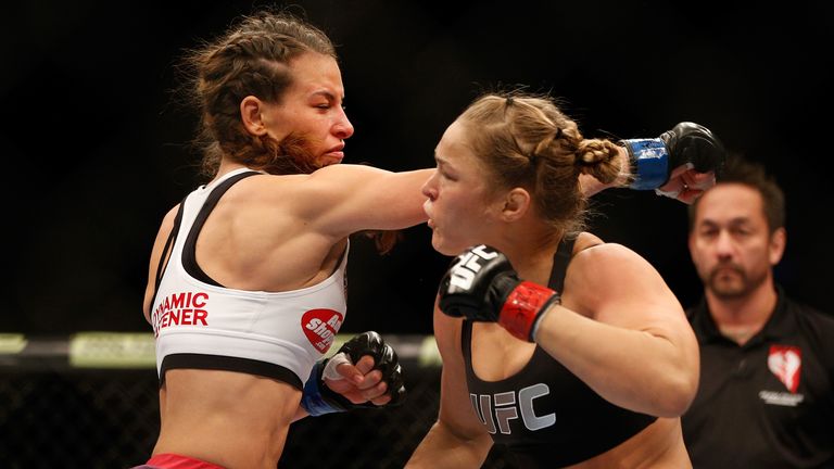 Rousey (right) has defeated long-time rival Tate twice