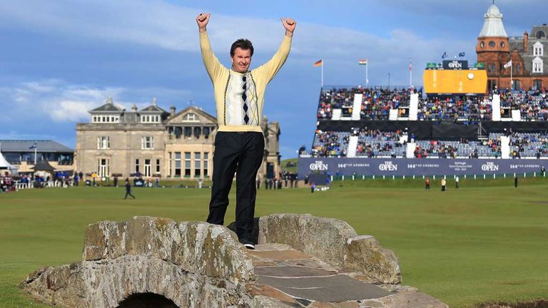 Sir Nick Faldo salutes the crowd from the Swilcan Bridge at St Andrews after his final round at the Old Course