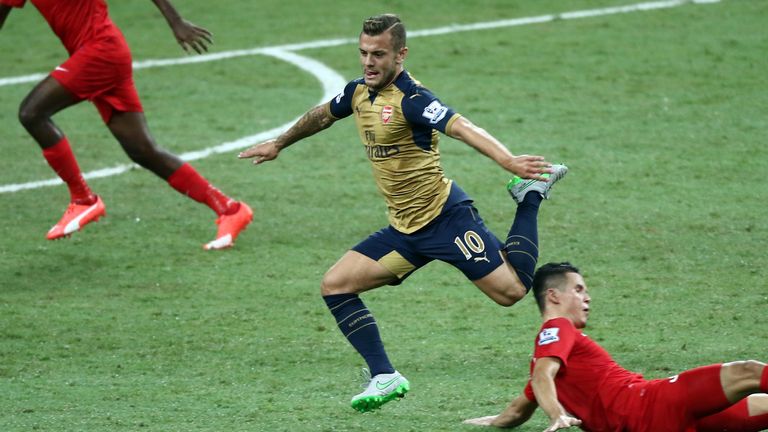 Jack Wilshere skips past a Singapore Select XI midfielder