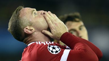 Wayne Rooney celebrates Manchester United's progression in the Champions League