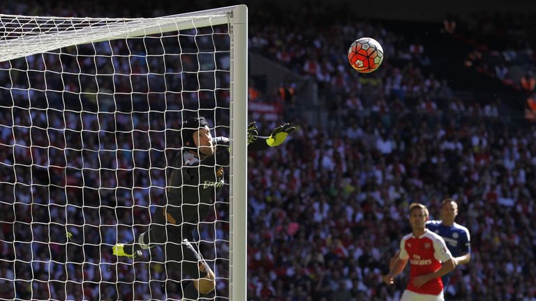 Arsenal goalkeeper Petr Cech (left) makes a save from a free-kick