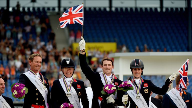 Carl Hester (left to right), Fiona Bigwood, Michael George Eilberg and Charlotte Dujardin celebrate on the podium