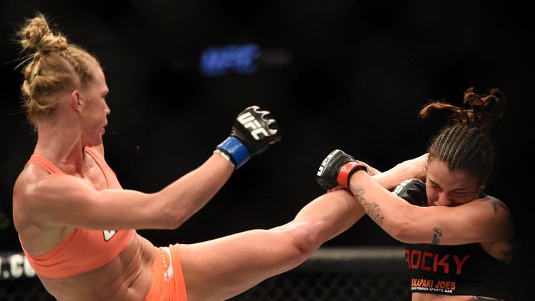 Holm lands a kick on Raquel Pennington