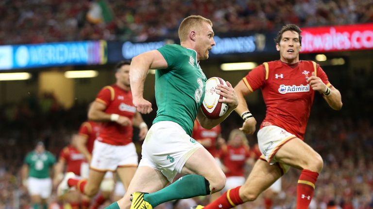 Keith Earls of Ireland breaks away to score a try against Wales