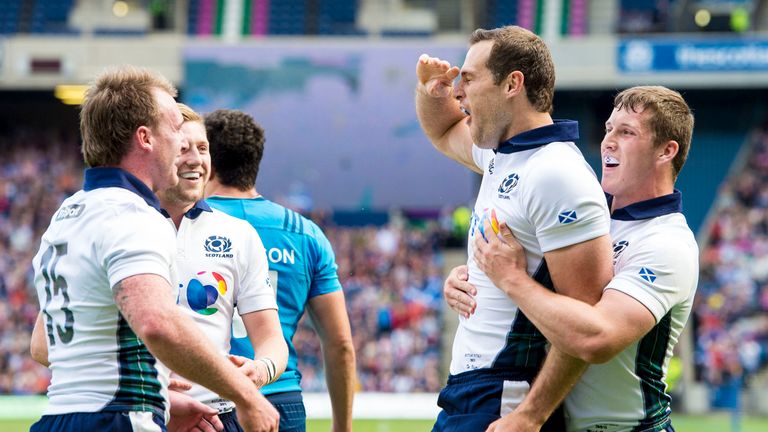 Scotland's Tim Visser (second from right) celebrates after scoring his first try