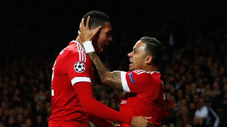 Smalling celebrates what would prove his winner with team-mate Memphis
