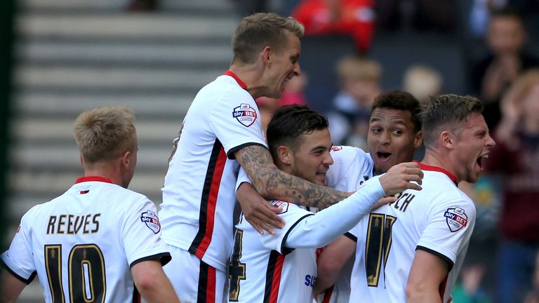 Josh Murphy (second right) celebrates scoring against Derby on loan at MK Dons