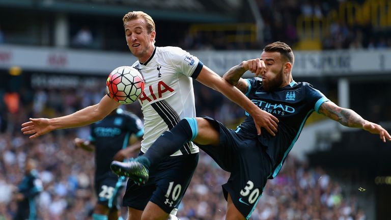 Kane and Nicolas Otamendi (right) compete for the ball