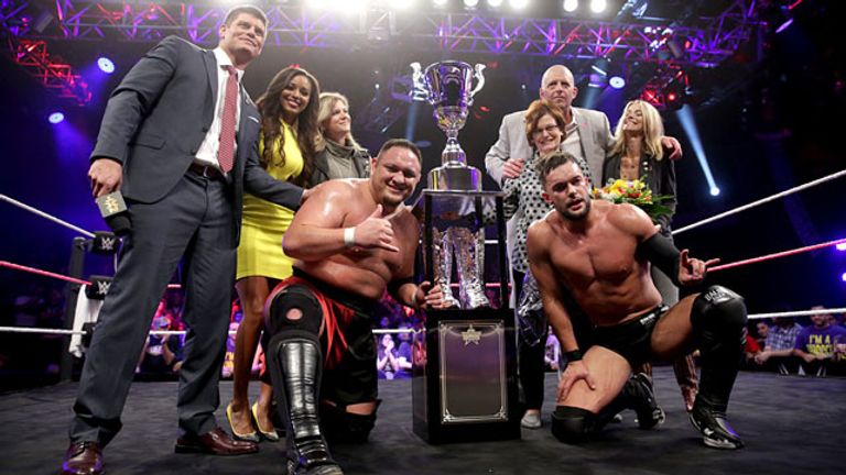 The Rhodes Family handed Samoa Joe and Finn Balor their trophy