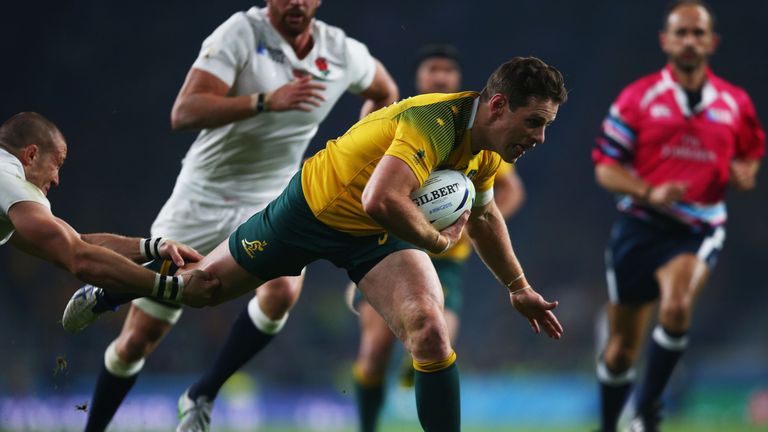 Bernard Foley breaks through to score Australia's first try