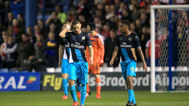 Arsenal's Kieran Gibbs walks away dejected after Sheffield Wednesday score their first goal