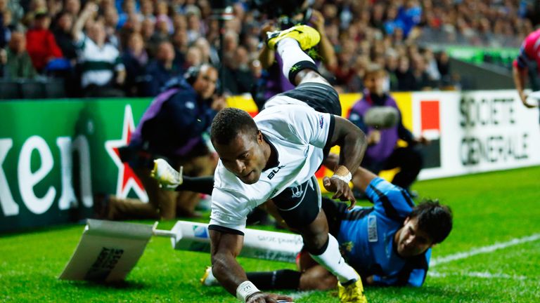 Fiji's Nemia Kenatale holds off Uruguay's Alejo Duran as he scores his side's second try