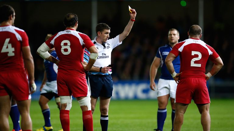 Referee George Clancy shows Jaba Bregvadze (hooker) a yellow card
