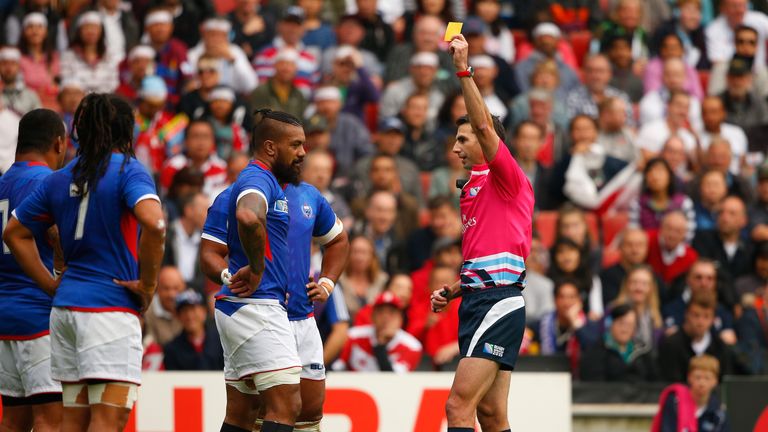 Referee Craig Joubert shows the yellow card to Samoa's Faifili Levave