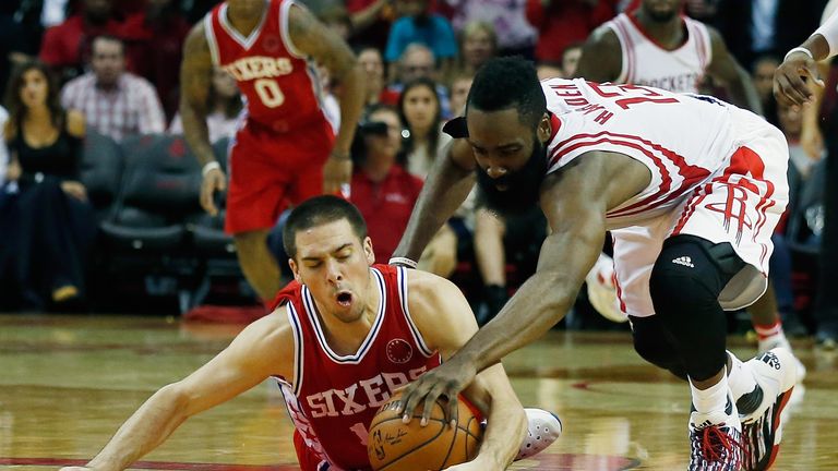 James Harden #13 of the Houston Rockets battles for the basketball with T.J. McConnell of the Philadelphia 76ers