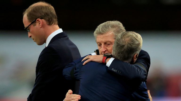England manager Roy Hodgson embraces France manager Didier Deschamps