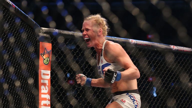 Holly Holm celebrates her victory over Ronda Rousey