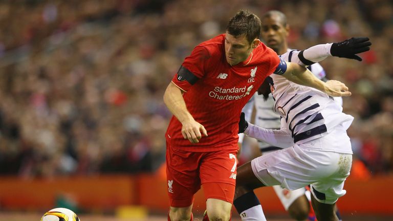 James Milner holds off Andre Biyogo Poko