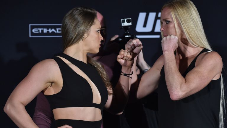 Rousey (left) faces off with opponent Holly Holm (right) ahead of their UFC fight in Melbourne