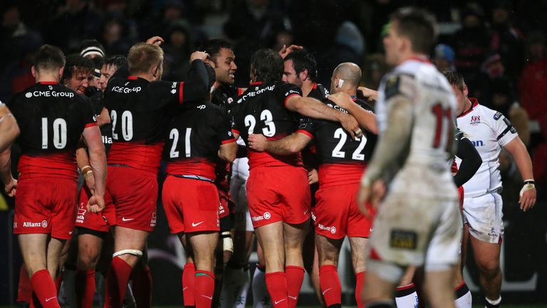 Saracens players celebrate after Billy Vunipola's late try gave secured a bonus-point victory