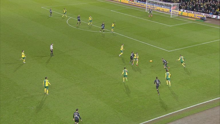 Arsenal's Santi Cazorla is booked for simulation after a challenge from Norwich's Jonny Howson