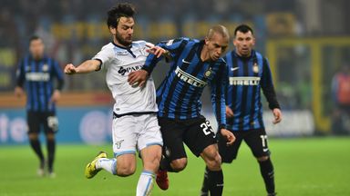 Inter Milan's Joao Miranda (r) fights for the ball with Lazio's Marco Parolo 