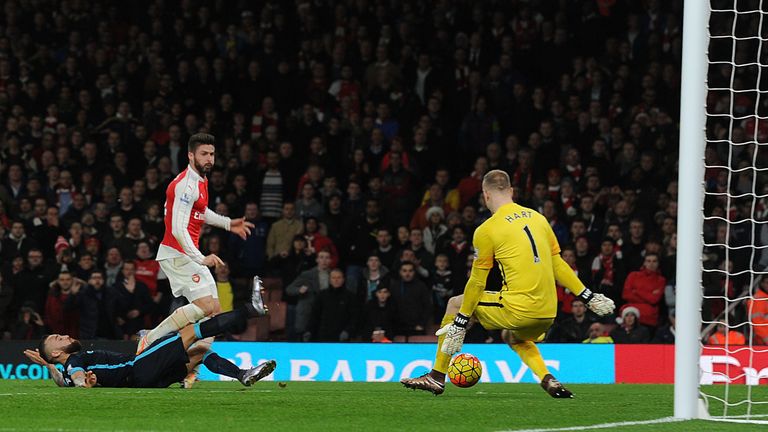 Giroud shoots past Man City goalkeeper Joe Hart to score Arsenal's second goal in first-half injury-time