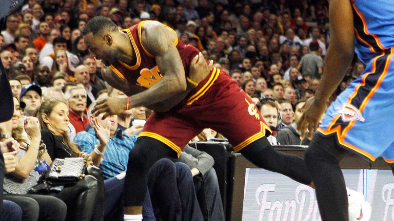 LeBron James tumbles off the court in Cleveland
