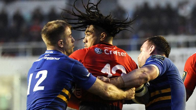 Toulon's New Zealander centre Ma'a Nonu  tries to wriggle away from Leinster's Luke Fitzgerald